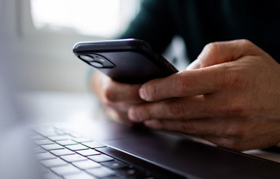 Focus on man hands typing message