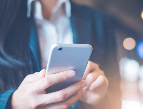 Close up shot of person typing on cellphone