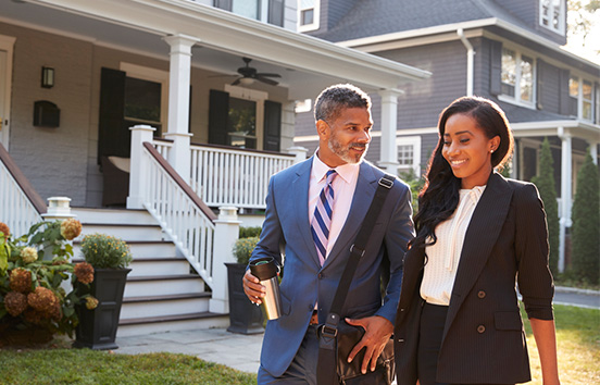 Executive couple leaving for work in the morning