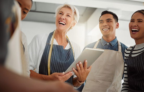Business owner with staff having meeting about retirement options