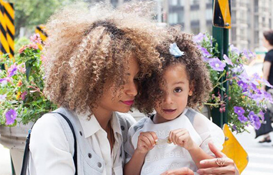 Mom with daughter in city