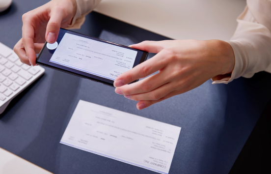 Person making a mobile deposit