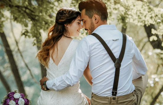 Wedding couple embracing outdoors
