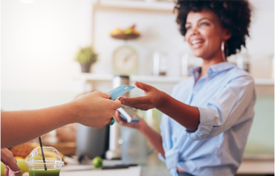 Business owner accepting Visa credit card