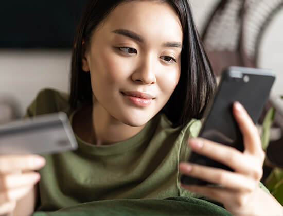 Young Asian woman buying from online shop