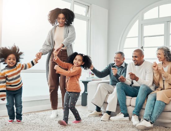 Multi generation family having fun in living room