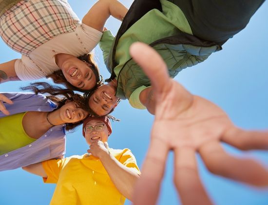 Teens taking photo with phone on the ground