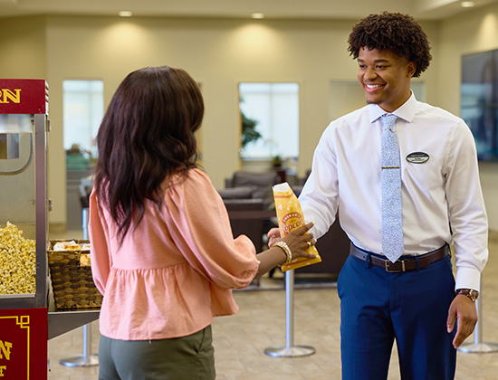 employee with popcorn