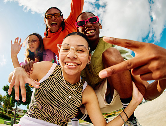 Wide angle shot of Gen Z group of friends hanging out together.