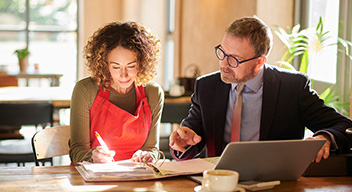 Cafe owner and business man doing finances