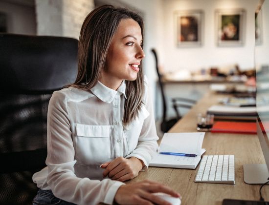 Female Business Professional on Desktop Computerr