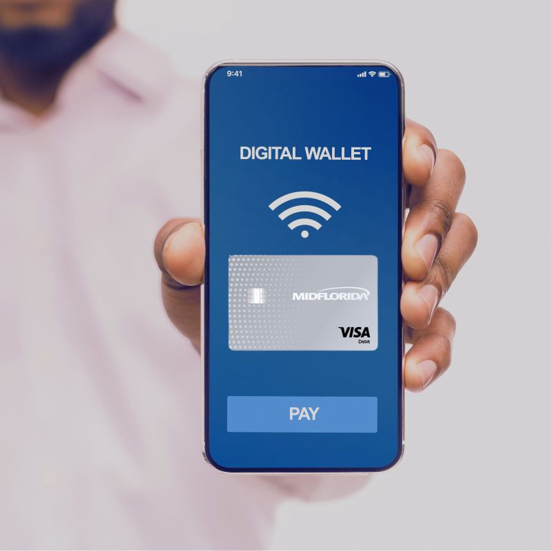 Hand holding phone with digital wallet