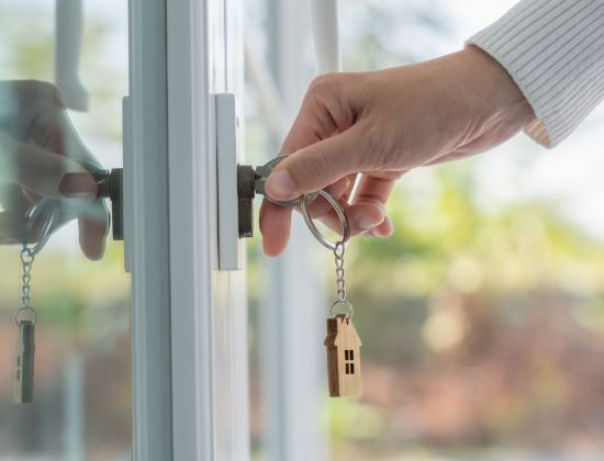 Hand with key in lock 