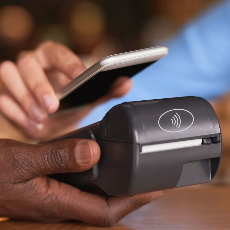 Holding phone to tap to pay