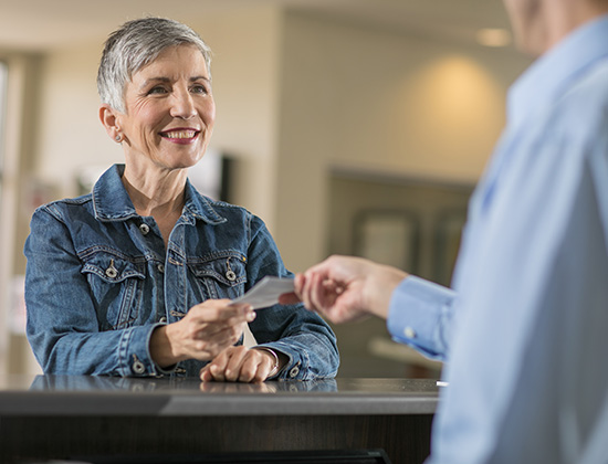 Older woman at teller station