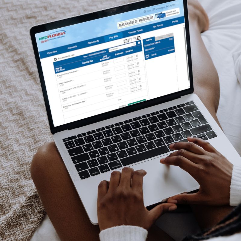 Woman using laptop paying bills