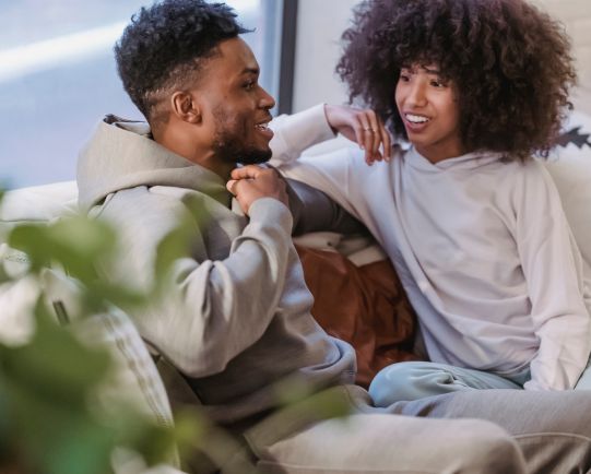 Young couple having a relaxed conversation about their financial future