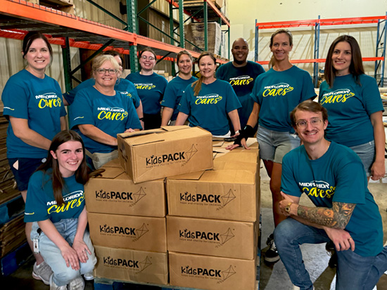 MIDFLORIDA Employees at Kid's Pack Lakeland